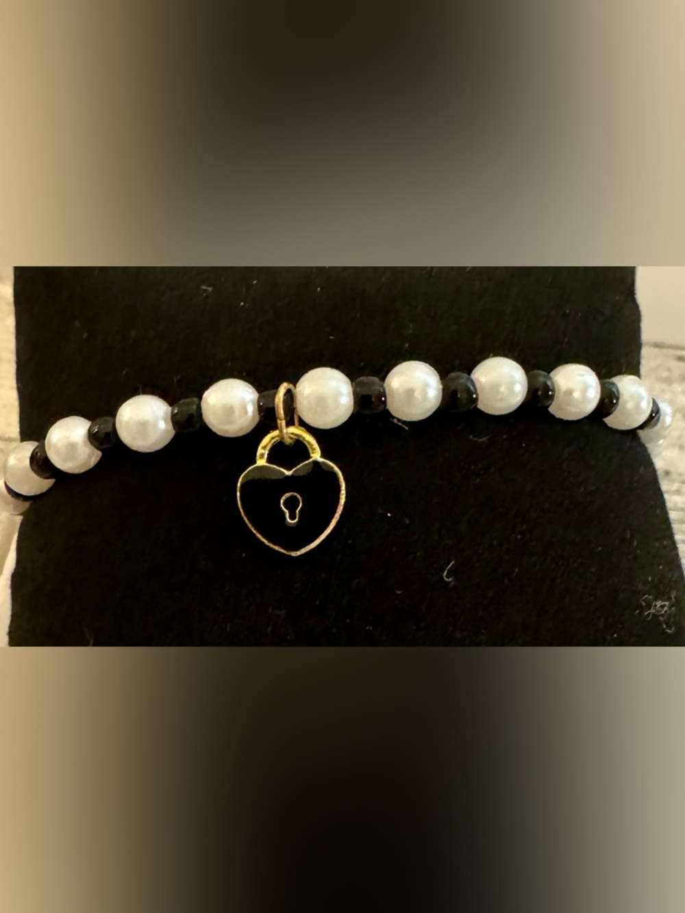 White Faux Pearl and Black Bead Bracelet with Gold Heart Lock Charm